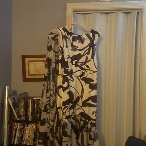 A beautiful woman’s asymmetric dress by Eloquii.